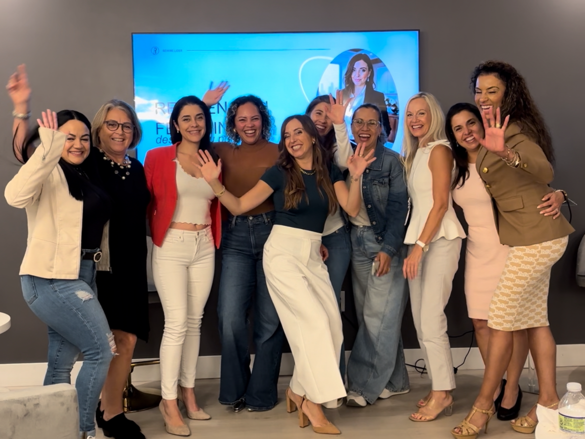 A cohort of women celebrating during The Art of Reinvention program